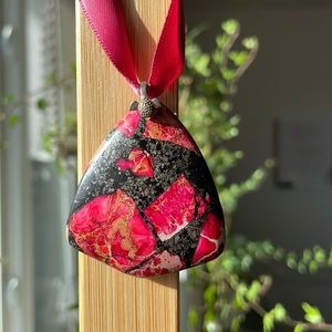Pink and black stone pendant